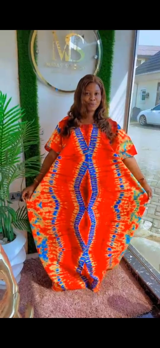 Radiate Elegance in Our Orange Floral Ankara Print
