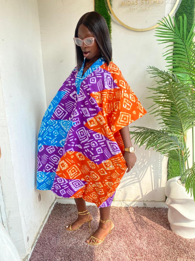 Bloom in Style with Our Floral Short Ankara Gown