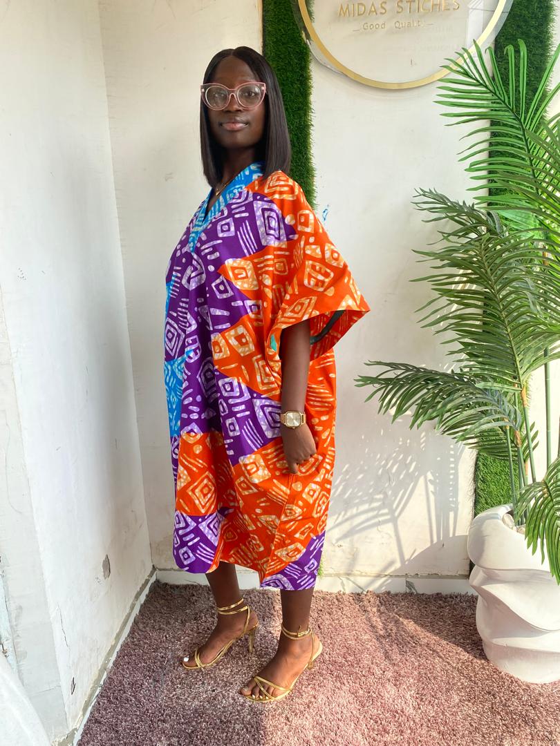 Bloom in Style with Our Floral Short Ankara Gown