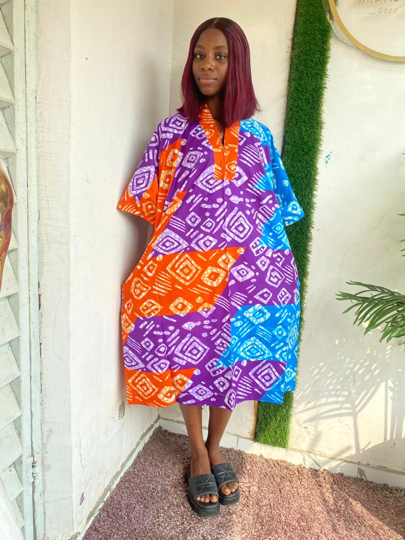 Bloom in Style with Our Floral Short Ankara Gown
