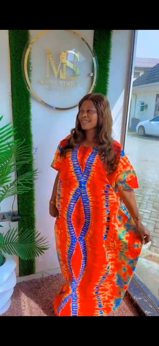 Radiate Elegance in Our Orange Floral Ankara Print